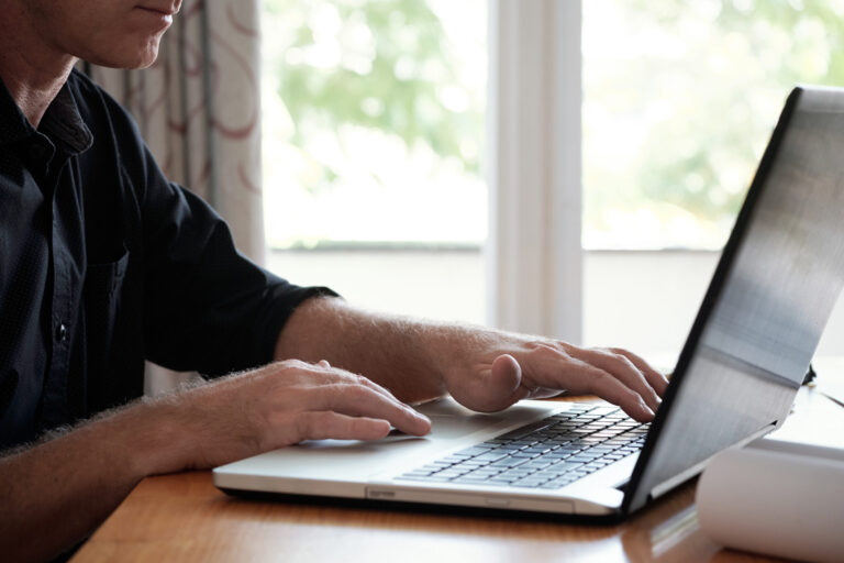 Mature Man Using Laptop